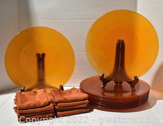Orange Glass Chargers And Rust-Colored Napkins